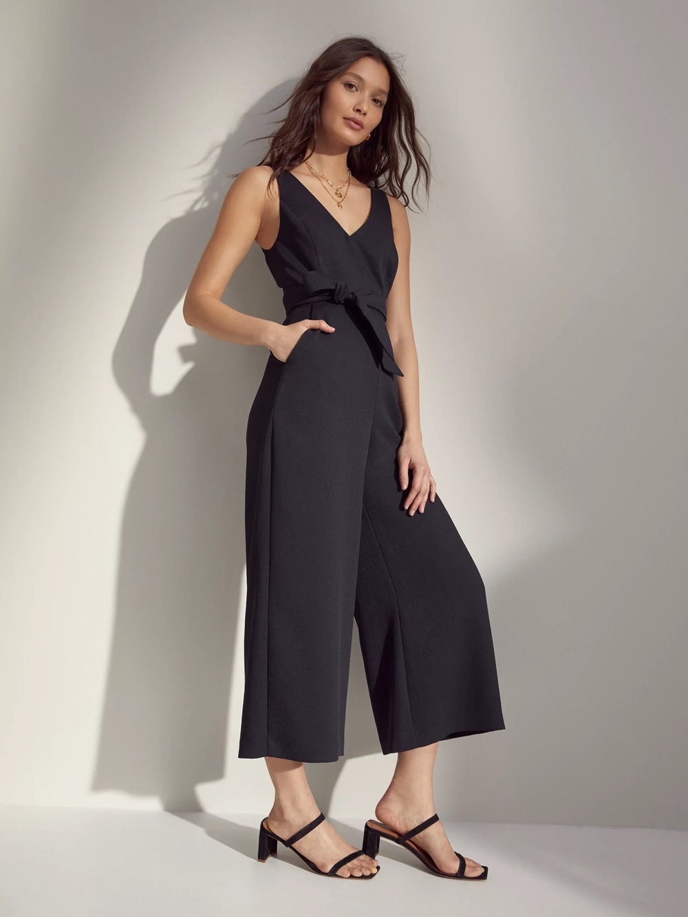 Aritzia Black V‑Neck Wide‑Leg Jumpsuit with Tie Waist